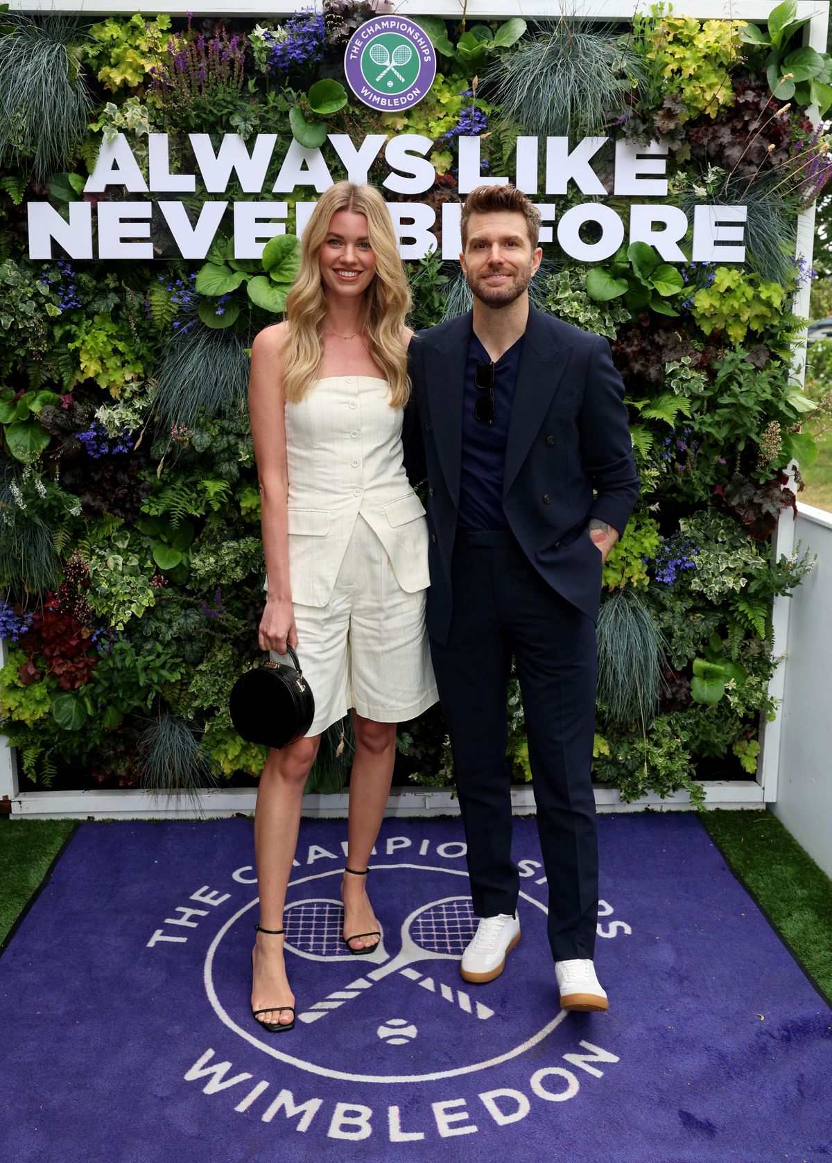 hannah and joel dommett posing in white at wimbledon