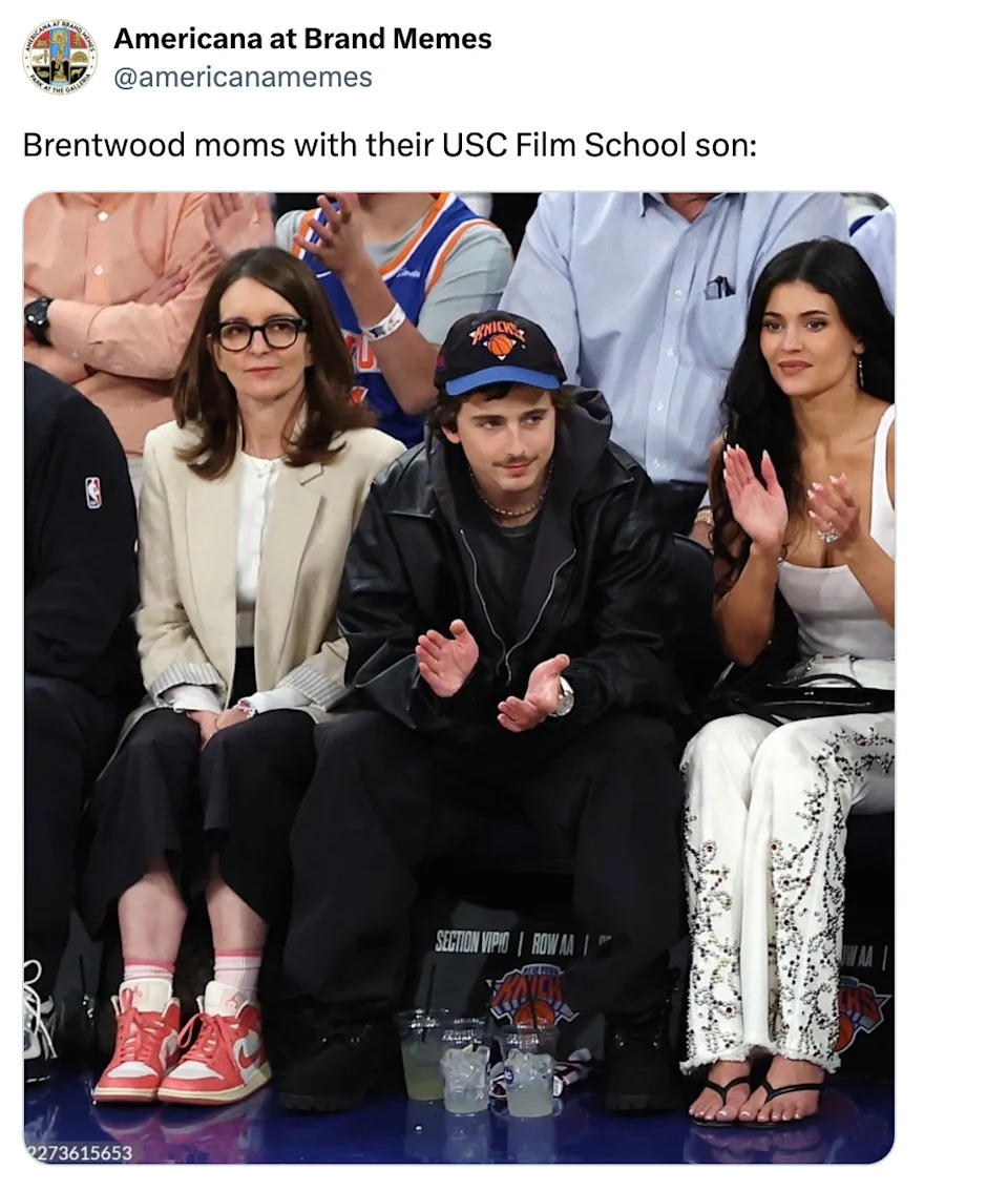 Three people are seated at an event, clapping. The caption humorously refers to them as "Brentwood moms with their USC Film School son."