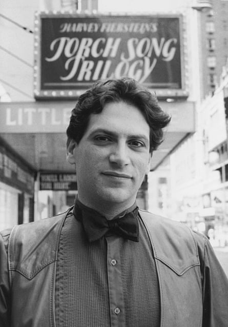 American playwright and actor Harvey Fierstein stands in leather vest and bow tie in front of the marquee of the Little Theatre (now the Helen Hayes Theatre) where his semi-autobiographical play, ‘Torch Song Trilogy,’ is playing, 240 West 44th Street, New York, early 1980s. The play was later made into a movie. (Photo by Bernard Gotfryd/Getty Images)