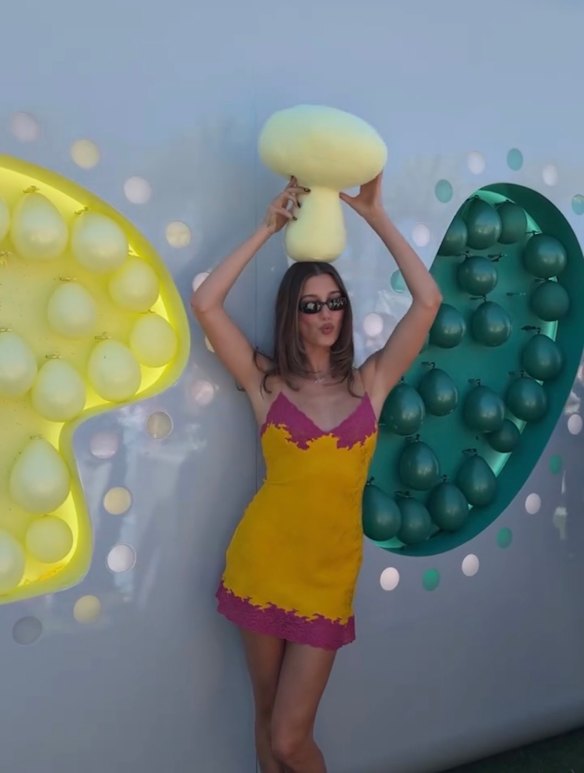 Hailey Bieber in a ’90s Christian Dior slip dress at the Rhode pimple patch activation at Coachella. 