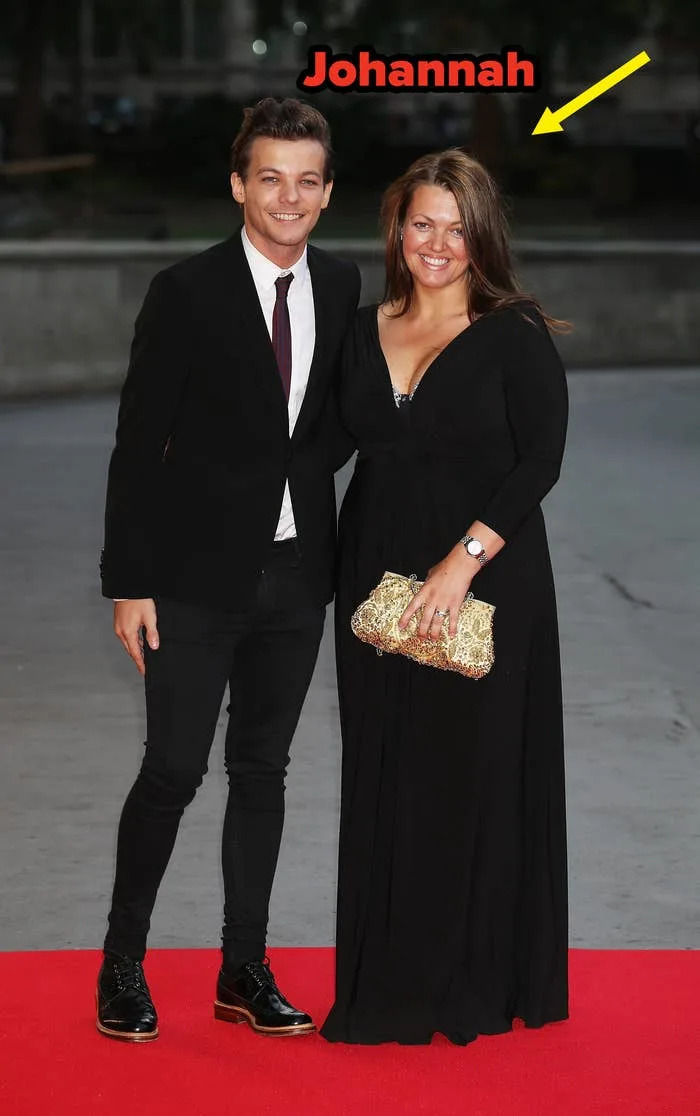 Louis Tomlinson in suit with a tie and his mom in a long dress holding a clutch on the red carpet