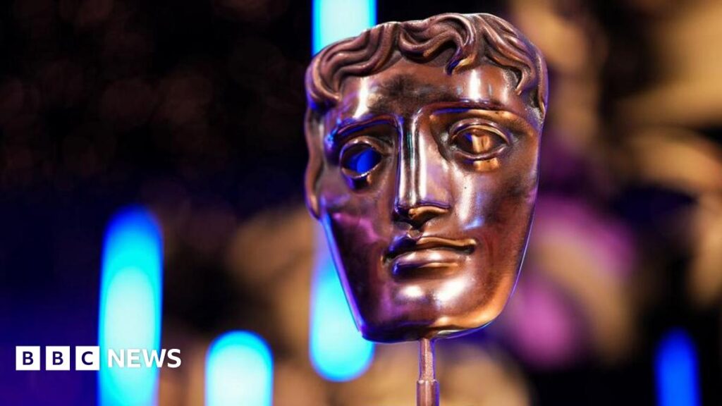 BBC upholds complaints over racial slur in Baftas broadcast A Bafta mask