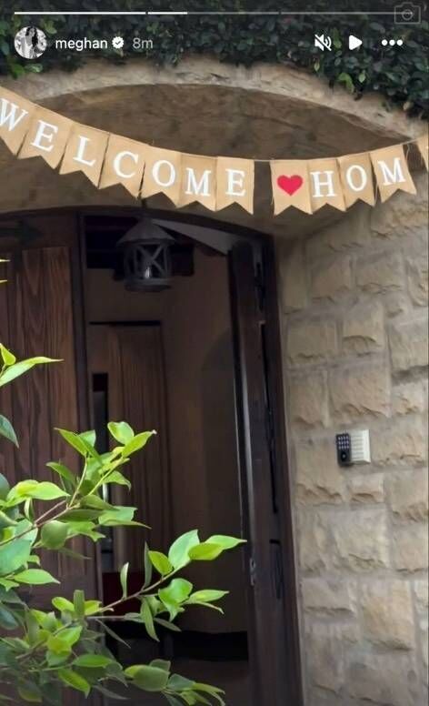 An image depicting a decorative banner made of burlap fabric. The banner features the words 