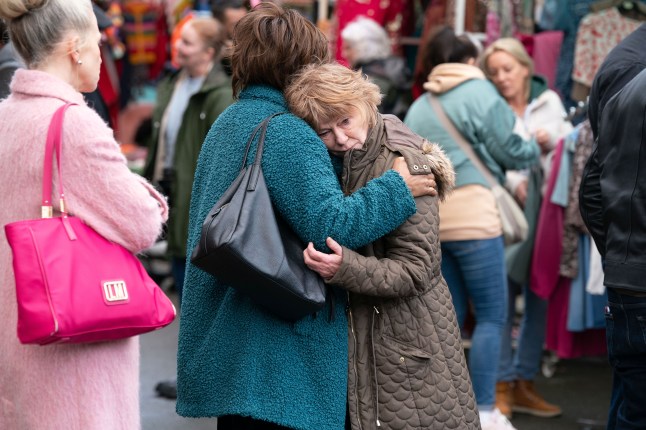 Julie is consoled by Yolande and Linda in EastEnders