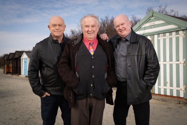 Grant, Nigel and Phil pose together at the seaside in EastEnders