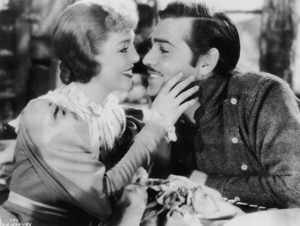 Loretta Young and Clark Gable gaze into each other's eyes in the film The Call of the Wild