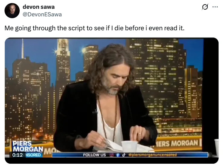 Man with long hair in open jacket reads script on TV set with city skyline. Caption jokes about checking script for survival