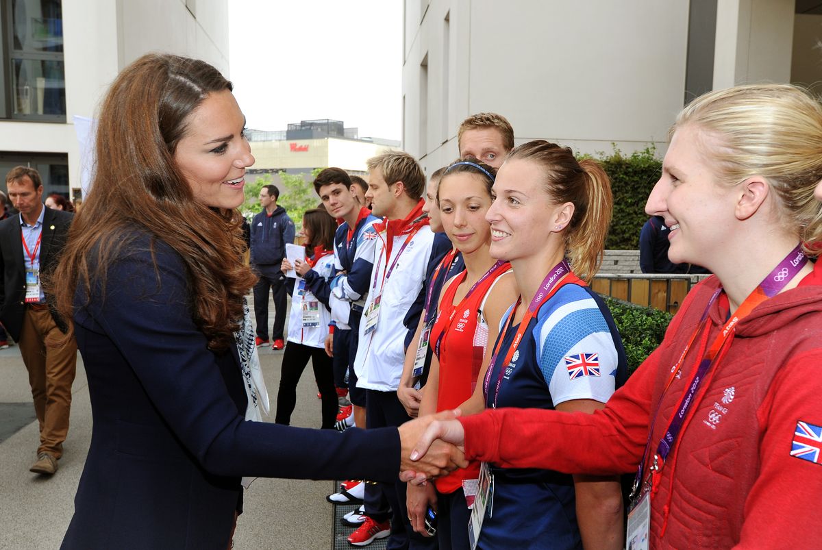 Kate Middleton speaks with Great Britain Swimmer Rebecca Adlington at the Athletes Village at the Olympic Park in Stratford on Day 4 of the London 2012 Olympic Games on July 31, 2012
