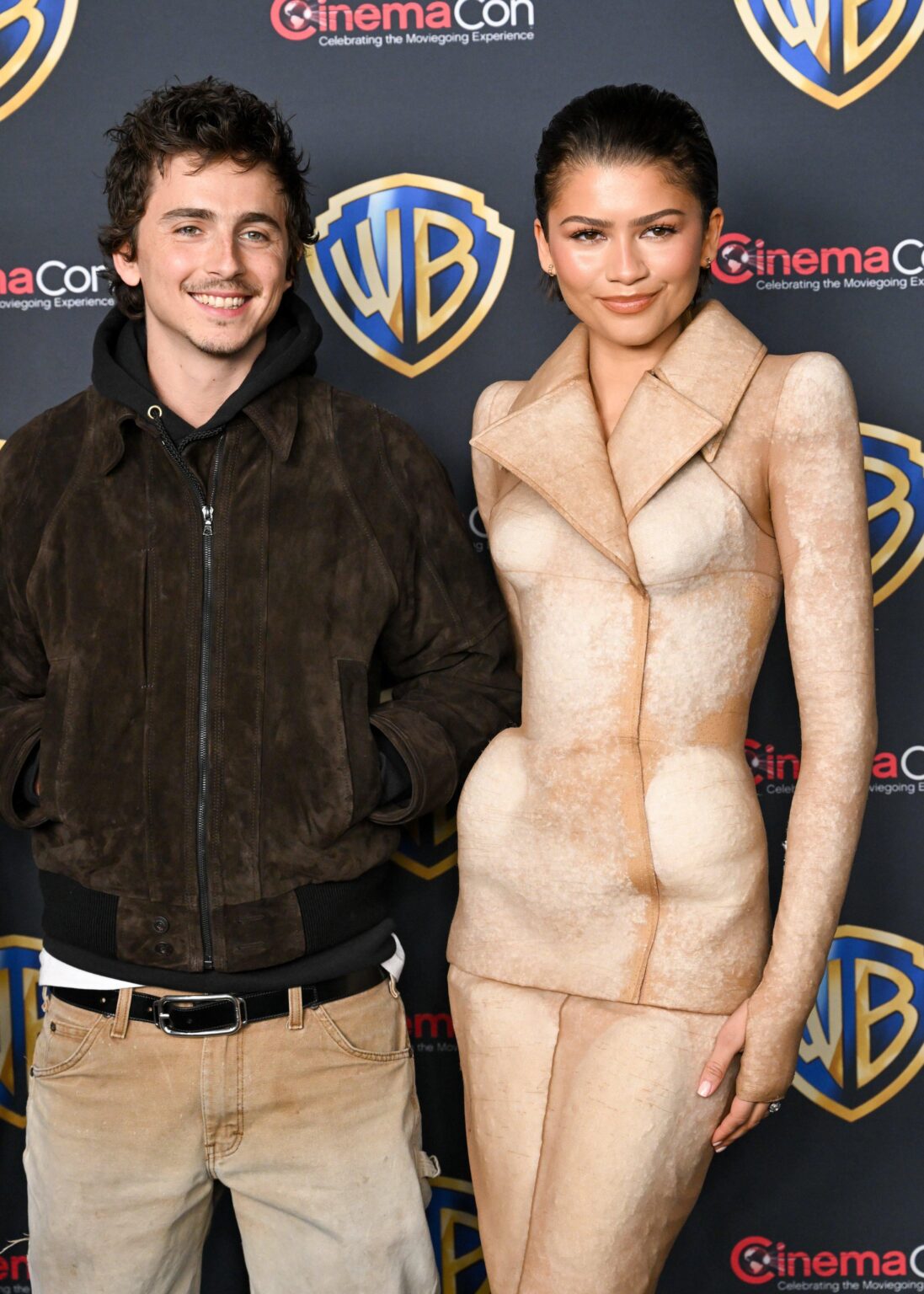 Timothée Chalamet and Zendaya pose together at CinemaCon for the “Dune 3” presentation.