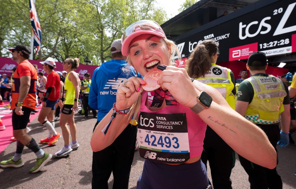 aimee fuller, former two time team gb winter olympian, poses with her medal at the finish line on the mall during the tcs london marathon on sunday 26th april 2026. photo: andrew baker for london marathon events for further information: media@londonmarathonevents.co.uk