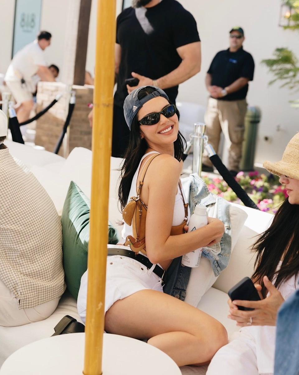 Group of people socializing at an outdoor event.