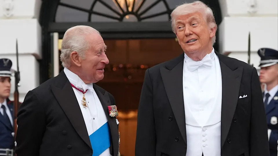 President Donald Trump greets Britain's King Charles III at the South Portico of the White House for a State Dinner.