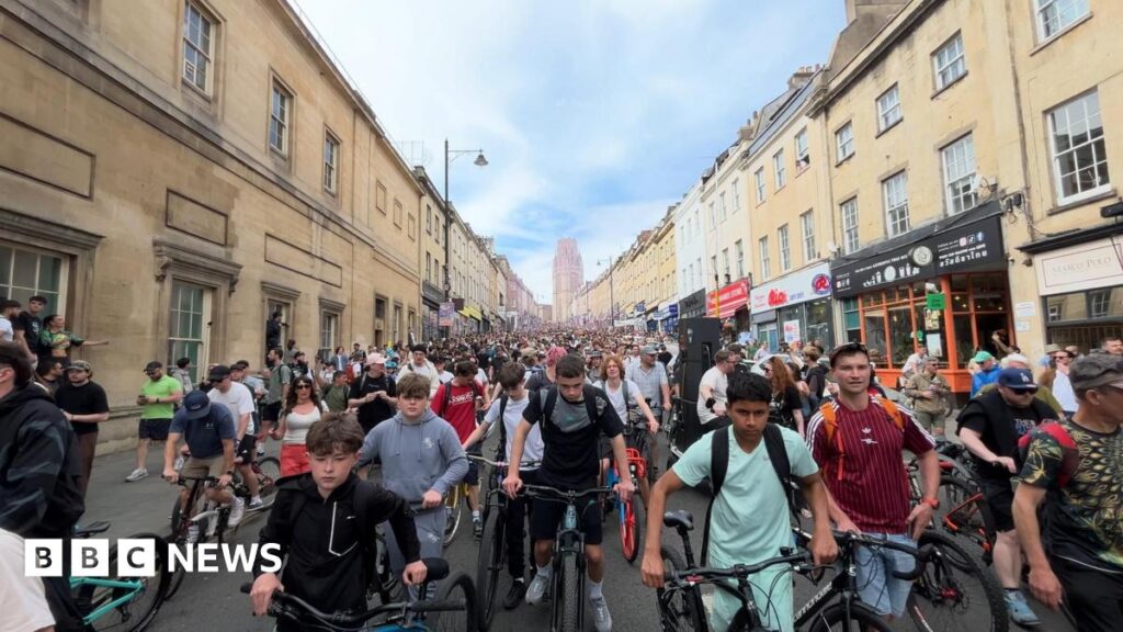 Hundreds of people on bikes in a road in Bristol.