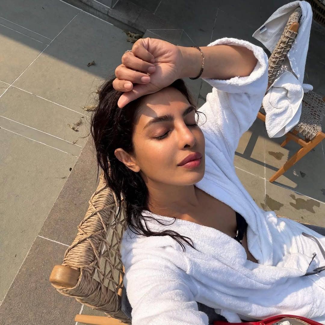 Priyanka Chopra sits by the pool in a black bikini and robe, shared on Instagram