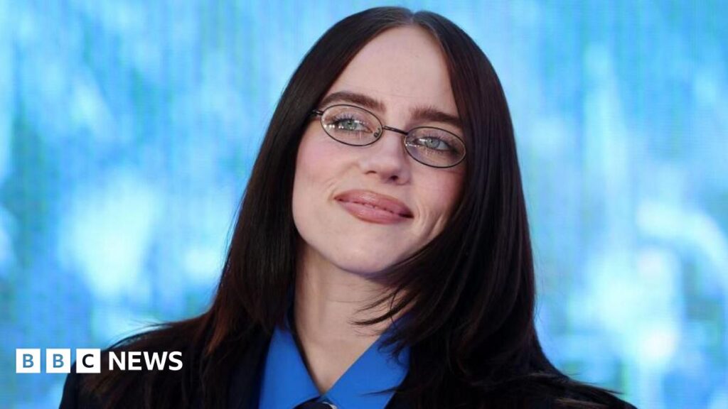 Eilish and Cameron on the blue carpet together.