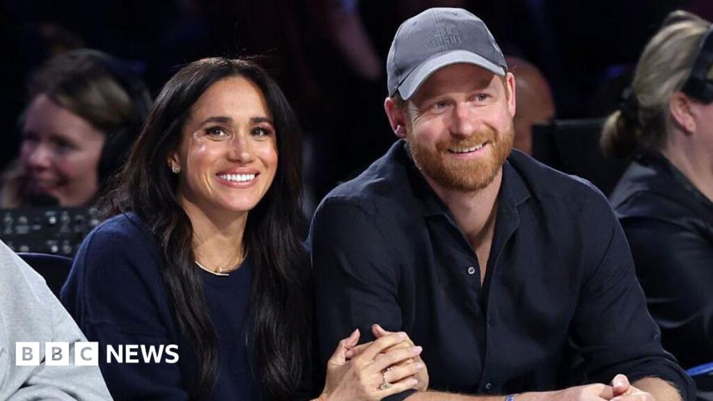 Harry and Meghan: Sussexes arrive in Australia for four-day tour Meghan, Duchess of Sussex and Prince Harry, Duke of Sussex sit courtside at a basketball game in California