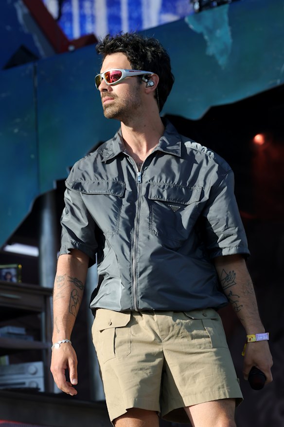 Joe Jonas in a Prada look borrowing from Steve Irwin’s utilitarian style at Coachella.