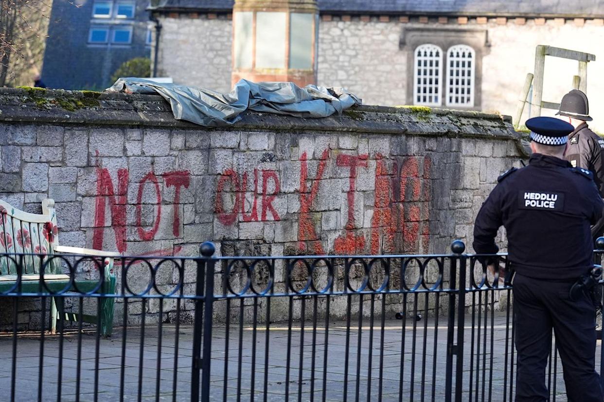 Spray painted graffiti on the wall outside St Asaph Cathedral in North Wales on April 2, 2026.Credit: Alamy