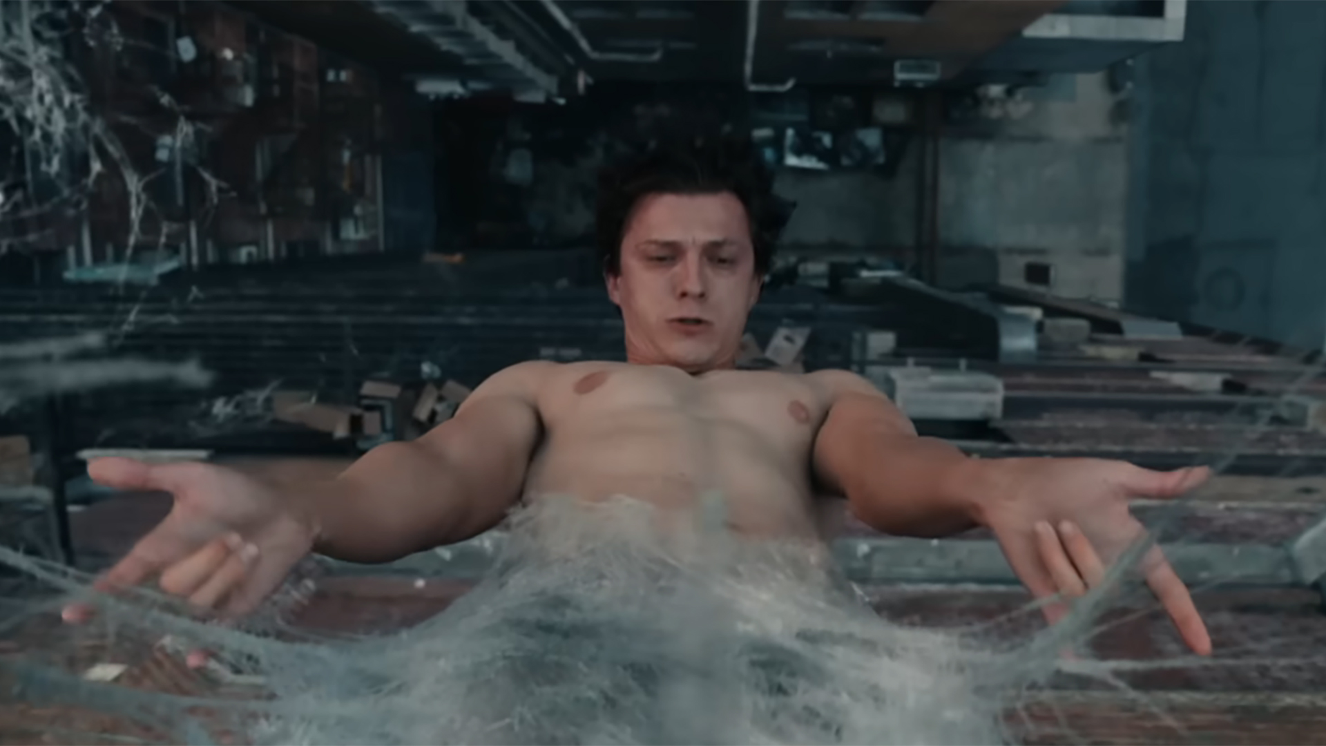 Peter Parker emerging from a web cocoon