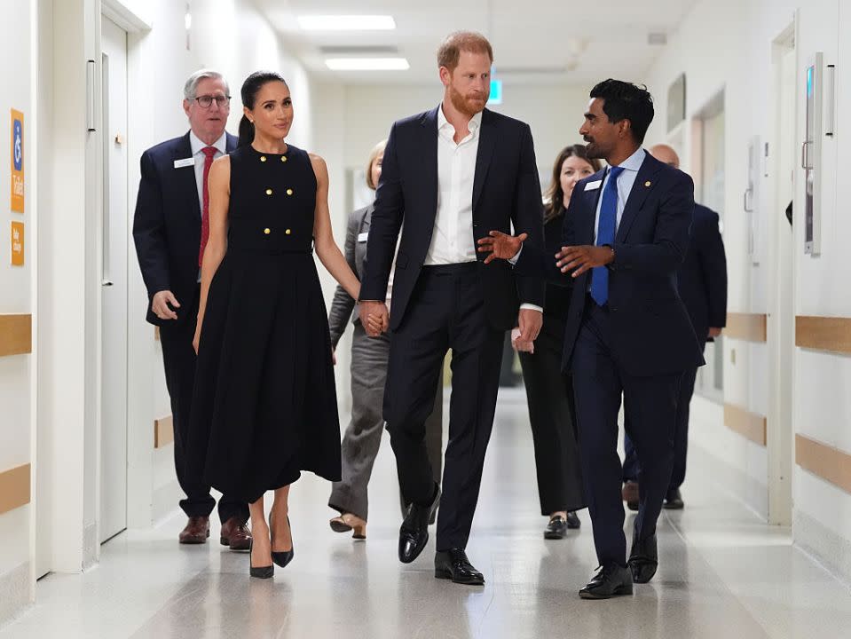 Meghan and Prince Harry talk with Kog Ravindran from the Royal Children's Hospital
