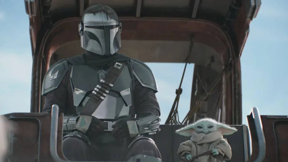  Din Djarin and Baby Yoda sitting together in the Super Bowl TV spot for The Mandalorian and Grogu. 
