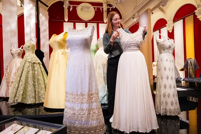 An evening dress designed by Norman Hartnell, worn by Queen Elizabeth II during a state visit to France in 1972, goes on display during the "Queen Elizabeth II: Her Life In Style" exhibition in The King's Gallery at Buckingham Palace