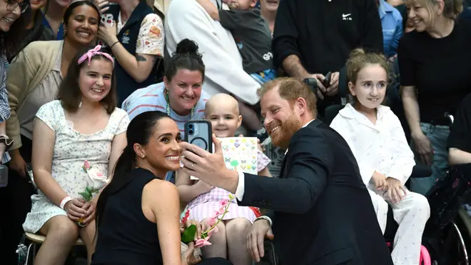 Melbourne, Australia. 14th Apr, 2026. Prince Harry and Meghan, the Duke and Duchess of Sussex greet children during their visit to the Royal Children's Hospital in Melbourne