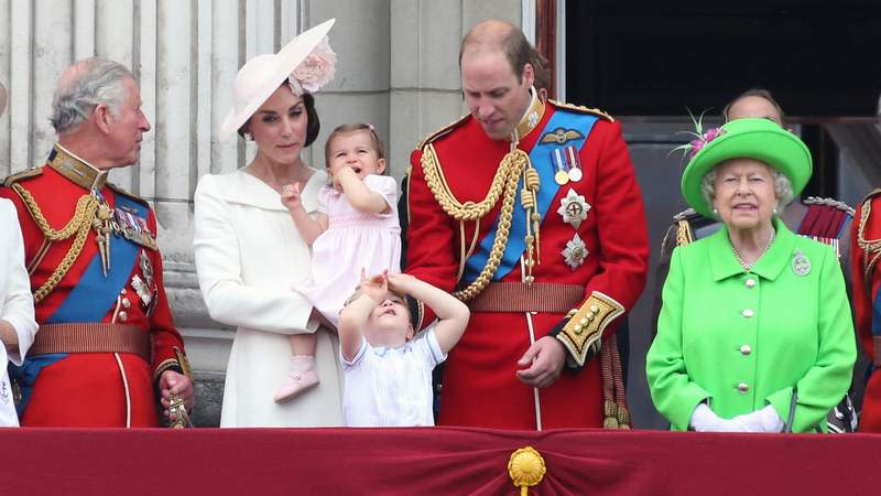 King Charles III, Kate Middleton, Princess Charlotte, Prince George, Prince William and Queen Elizabeth II watch the RAF centenary fly-past at Buckingham Palace in 2018. By: MEGA