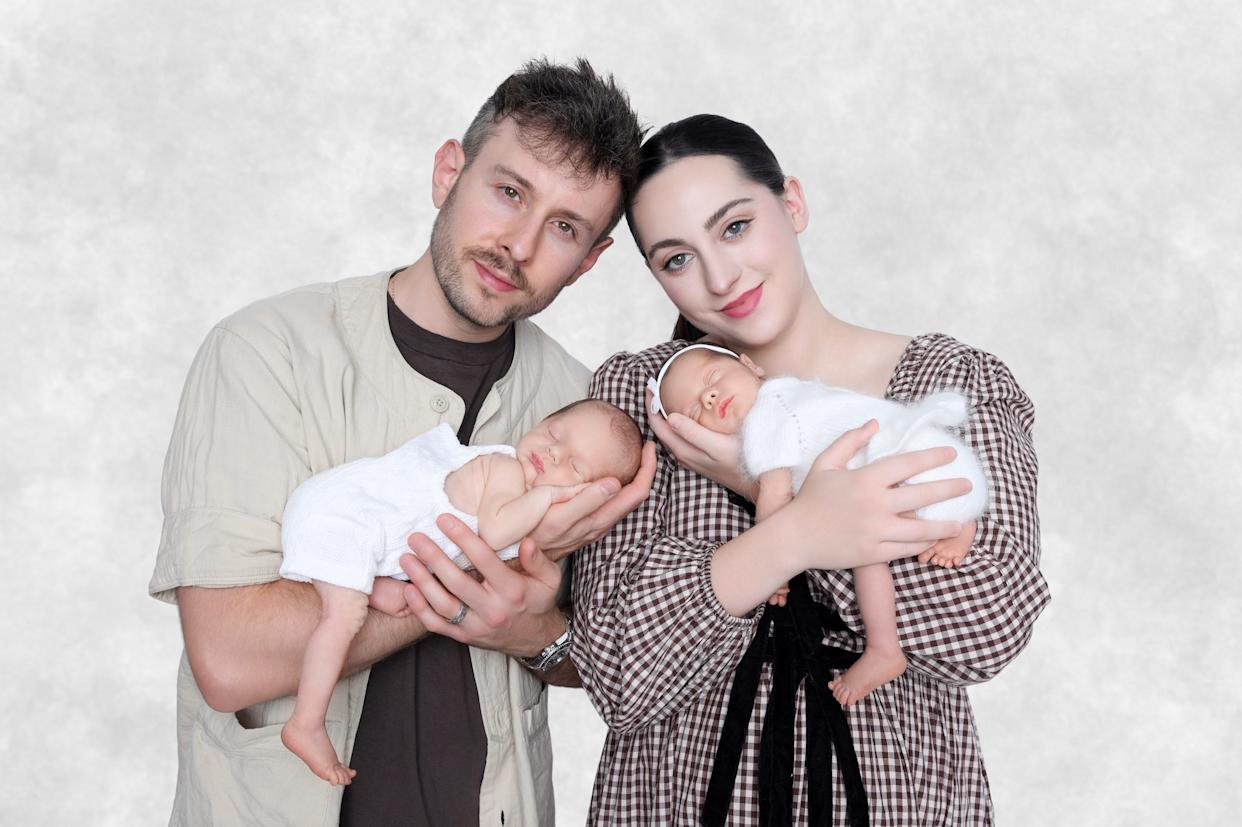 Parents holding twins