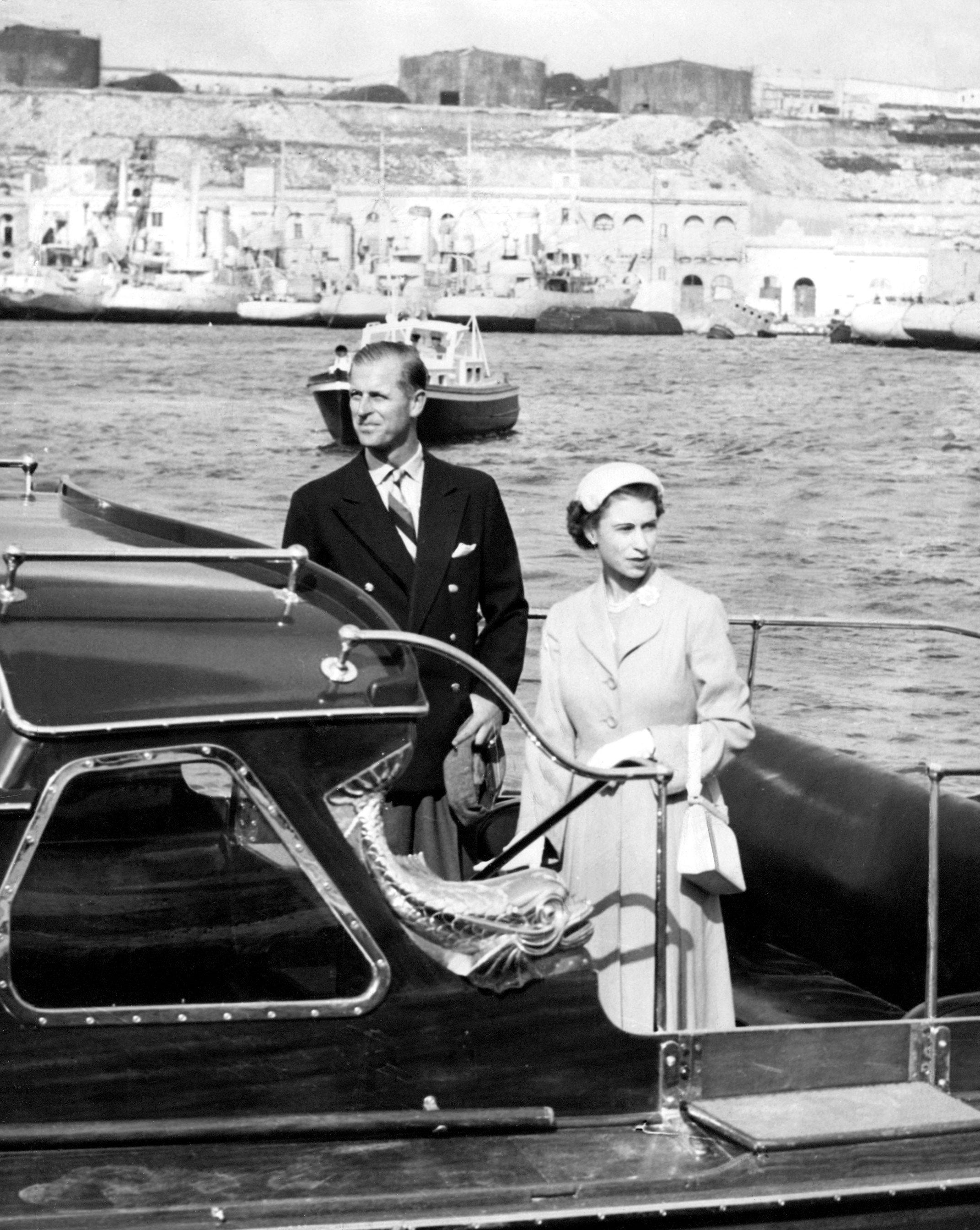 Queen Elizabeth II and Prince Philip leave Malta harbour to go aboard the Royal Yatch Britannia May 1954