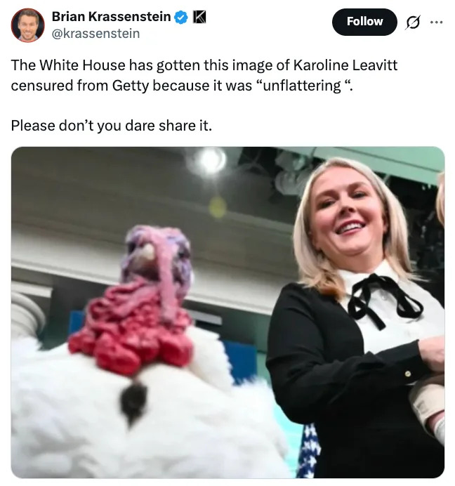 Person smiling with a turkey in the foreground at a formal event, as noted in a tweet about its perceived unflattering nature