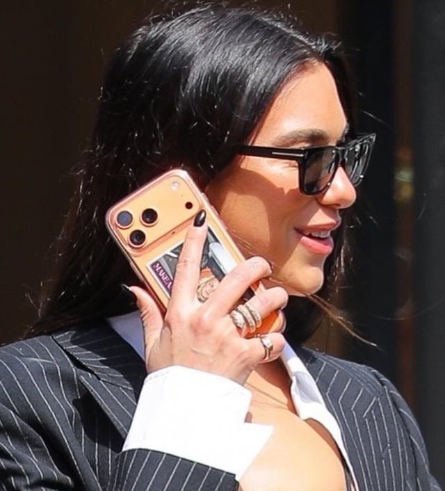 Dua Lipa having that iconic photo of Britney Spears, Lindsay Lohan and Paris Hilton on her iPhone