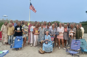 Julie McTernan hosts a book club gathering on the beach.