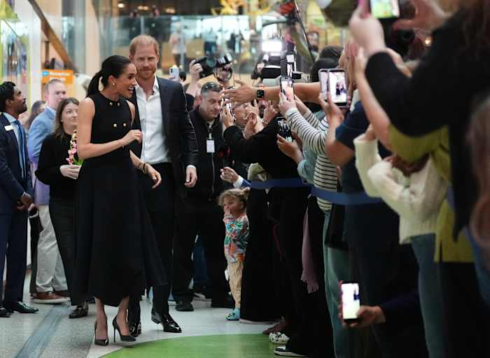 Prince Harry and Meghan arrive in Australia for a low-key, privately funded visit