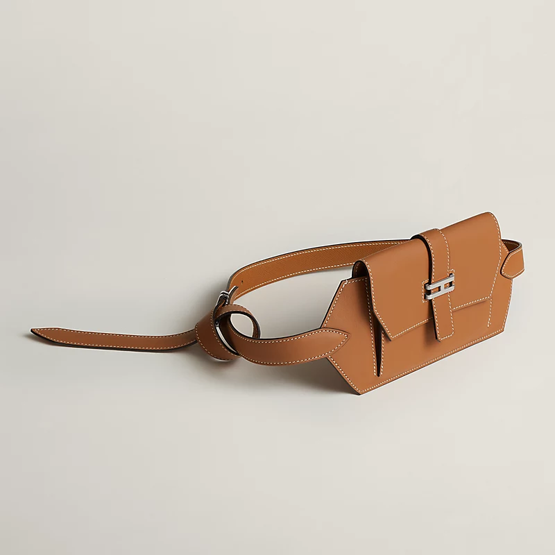 A H&egrave;rmes brown belt bag.