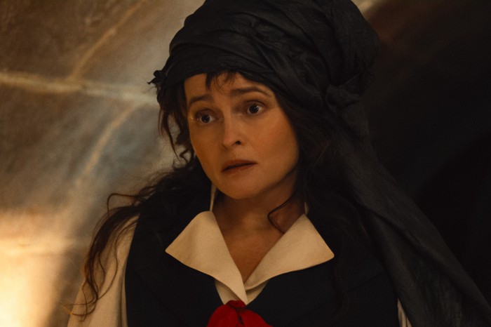 A woman in a corridor.