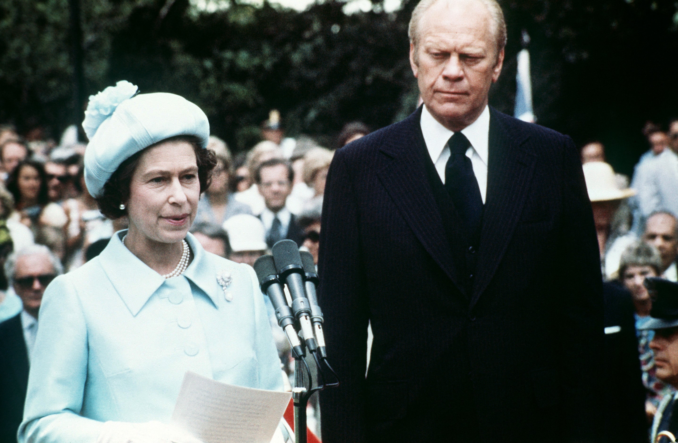 Queen Elizabeth II gives a speech during her 1976 visit, standing next to the then US president Gerald Ford