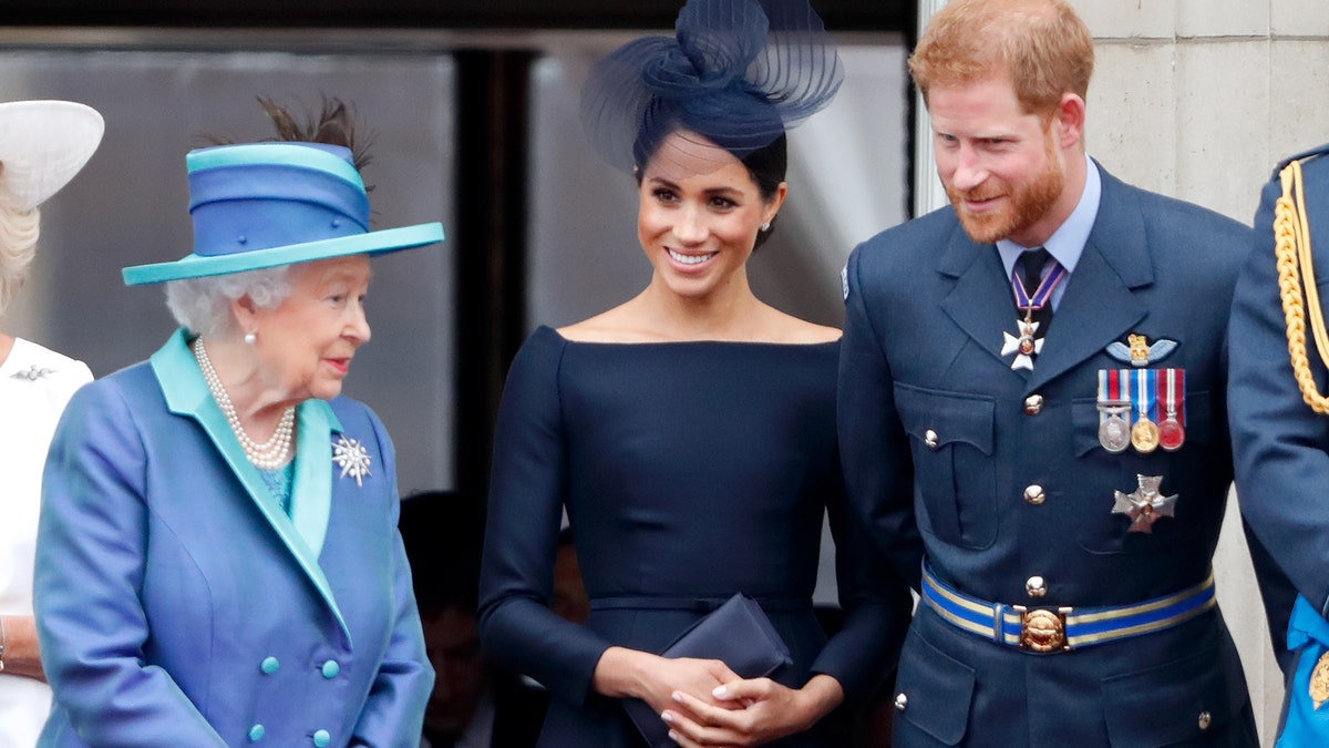 Queen Elizabeth with Meghan Markle and Prince Harry