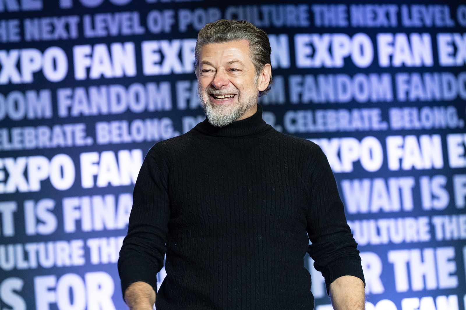 Image may contain Andy Serkis Face Happy Head Person Smile Laughing Adult and Dimples