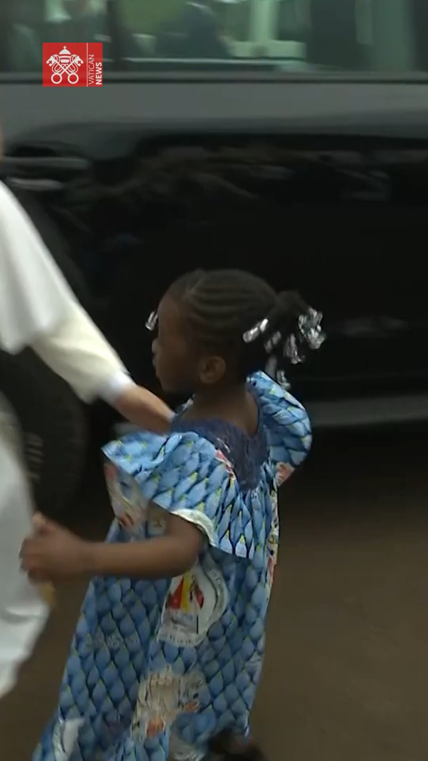 A young girl in Cameroon reached out for a hug from the Pope, and received it in addition to a Rosary