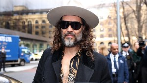 Russell Brand leaves Southwark Crown Court in south London on Feb. 24, 2026 after attending a one-day plea and trial preparation hearing. (Adrian Dennis/AFP via Getty Images)