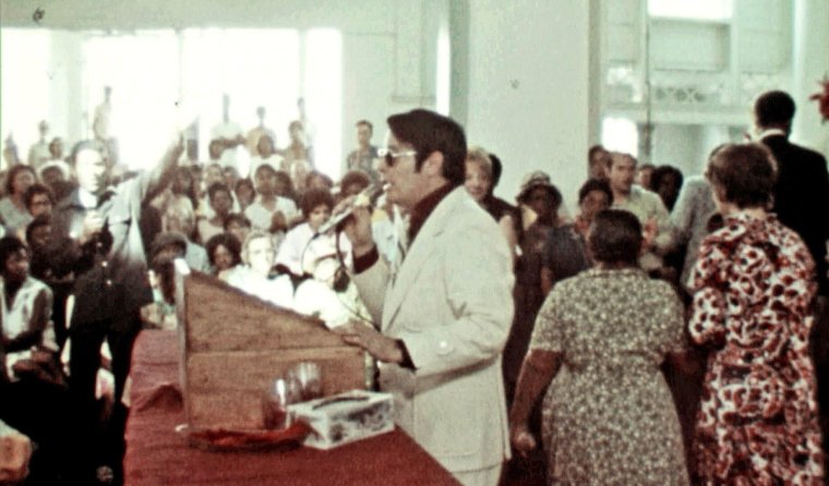 Jim Jones addresses his congregation from the pulpit in California. (California Historical Society) Cult Massacre: One Day in Jonestown TV still Hulu