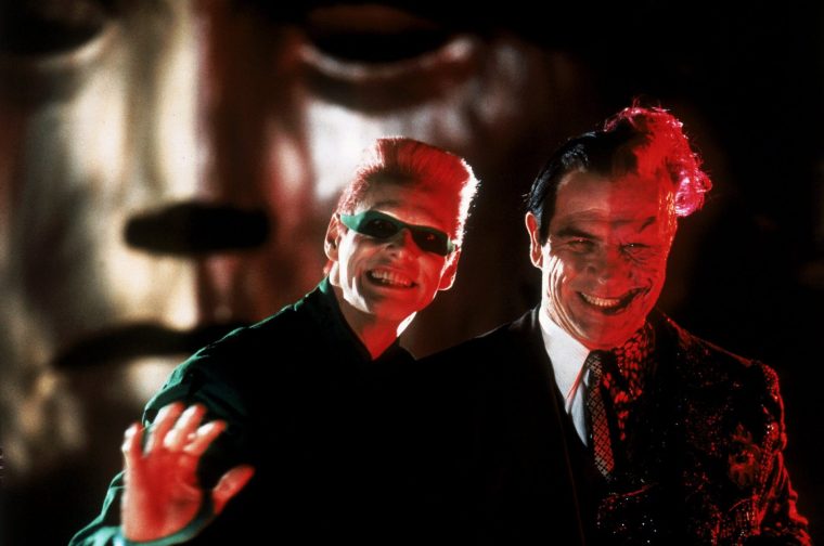 BATMAN FOREVER - The Dark Knight is back on the big screen for the third feature in the blockbuster Batman series ... now battling two supervillains simultaneously--but this time joined by his prot??g??, Robin, to protect Gotham City. Jim Carrey stars as criminal genius, The Riddler, and Tommy Lee Jones plays Two-Face. Together, these criminal kingpins present a threat that only the Dynamic Duo--Batman (Val Kilmer) and Robin (Chris O'Donnell)--can stop. And Academy Award winner Nicole Kidman comes to Gotham as the alluring Dr. Chase Meridian, who may steal the heart of Batman Forever.