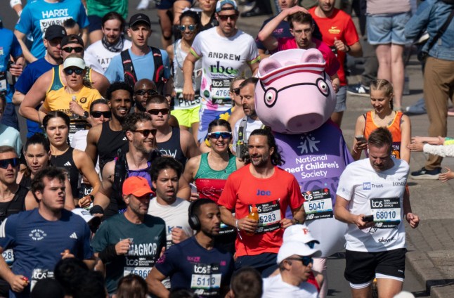 Mandatory Credit: Photo by Benjamin Gilbert for London Marathon Events/Shutterstock (16846660b) Daddy Pig and Joe Wicks pass the one mile mark during the TCS London Marathon on Sunday 26th April 2026. Photo: Benjamin Gilbert for London Marathon Events. For further information: media@londonmarathonevents.co.uk TCS London Marathon, UK - 26 Apr 2026