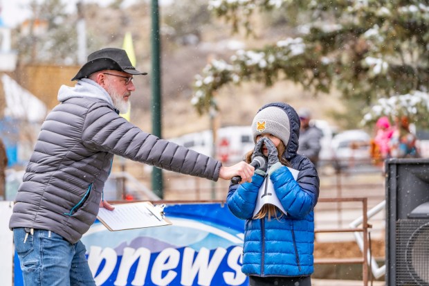 A young festivalgoer competes in the Bigfoot Calling Contest at the 2025 Bigfoot Days Festival in downtown Estes Park. (Courtesy Town of Estes Park)