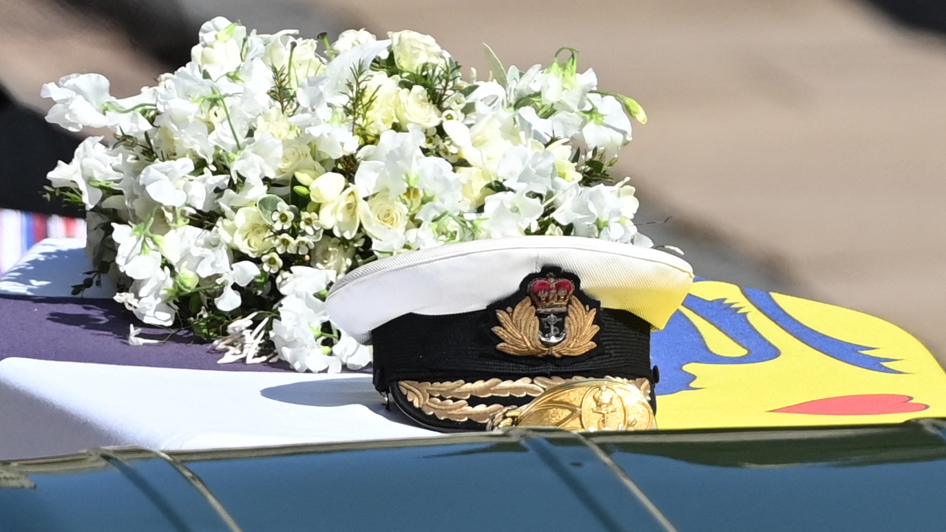 A wreath of flowers lies on the coffin during the ceremonial funeral procession of Britain's Prince Philip, Duke of Edinburgh to St George's Chapel in Windsor Castle