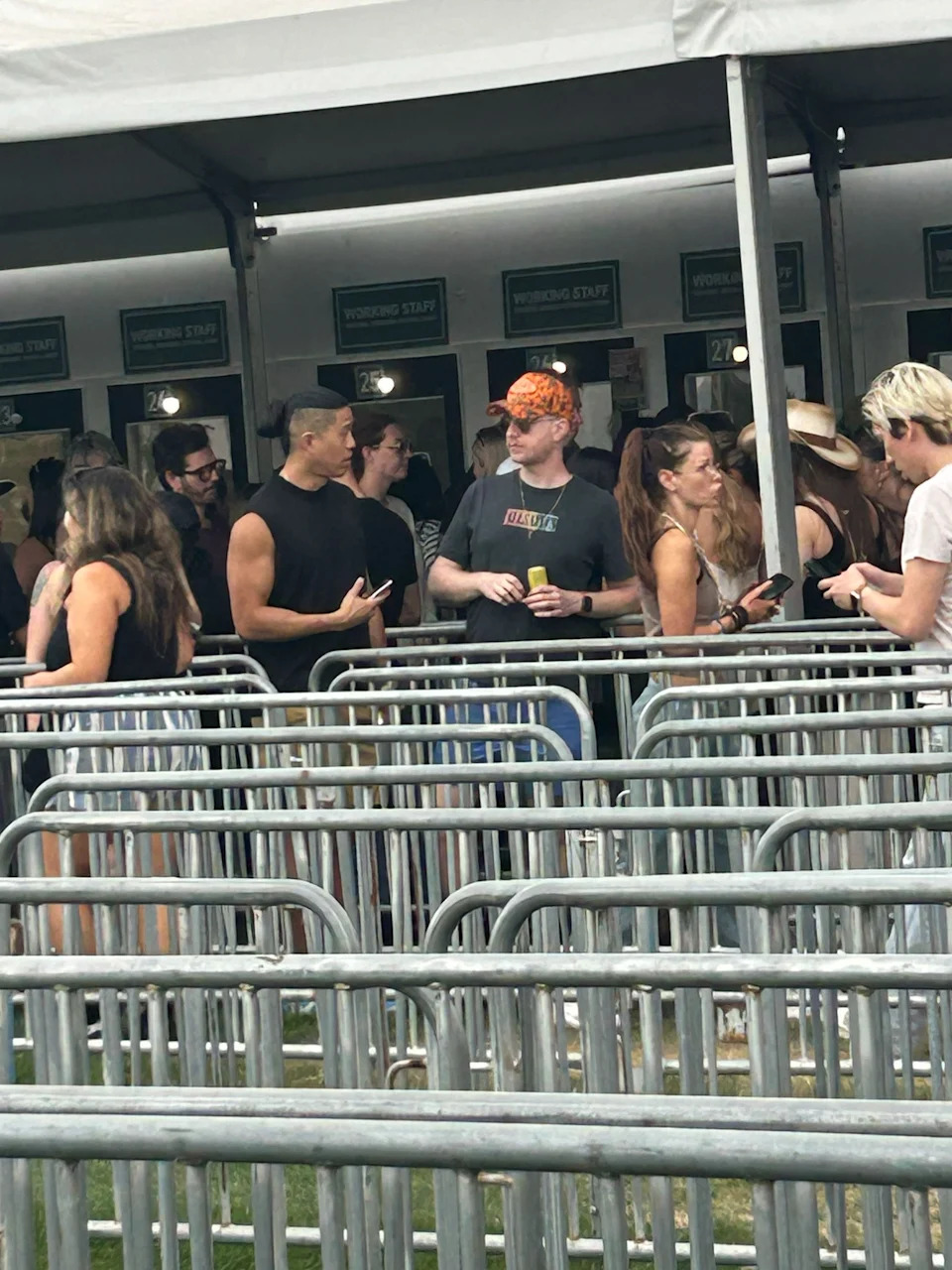 Daniel Wai (far left), a friend and "Vanderpump Rules" star Ariana Madix wait in line for their Coachella Valley Music and Arts Festival wristbands on Thursday, April 9, 2026 at the Indian Wells Tennis Gardens in Indian Wells, Calif.