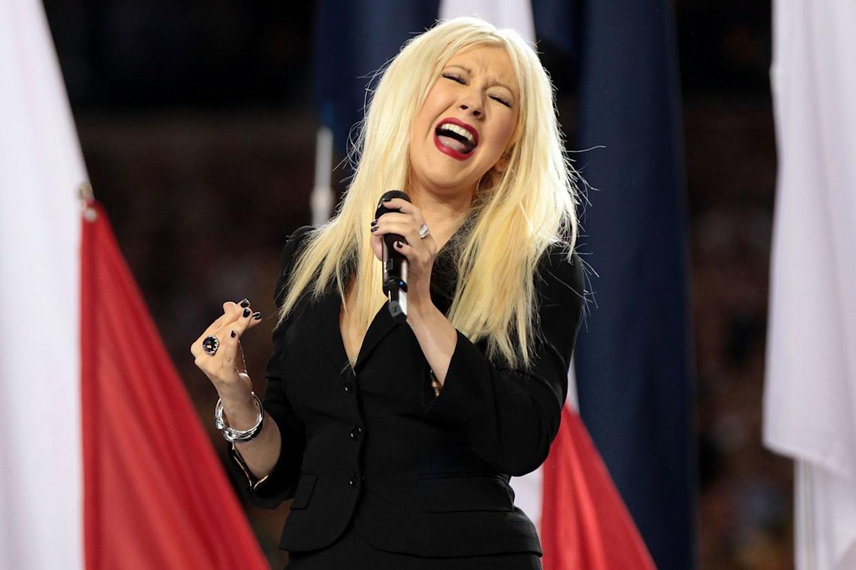 Christina Aguilera sings the National Anthem during Super Bowl XLV on February 6, 2011 in Arlington, Texas.Credit: Jamie Squire/Getty