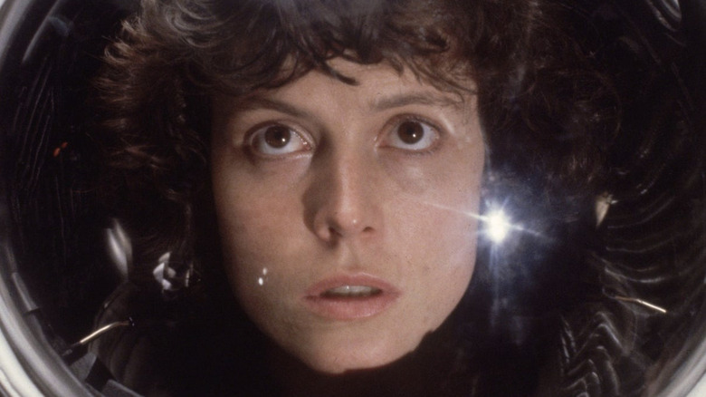 Sigourney Weaver as Ripley wearing a space suit in Alien