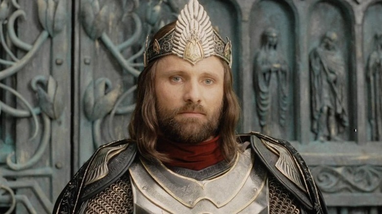 Aragorn (Viggo Mortensen) stands in his kingly armor and crown in The Lord of the Rings: The Return of the King